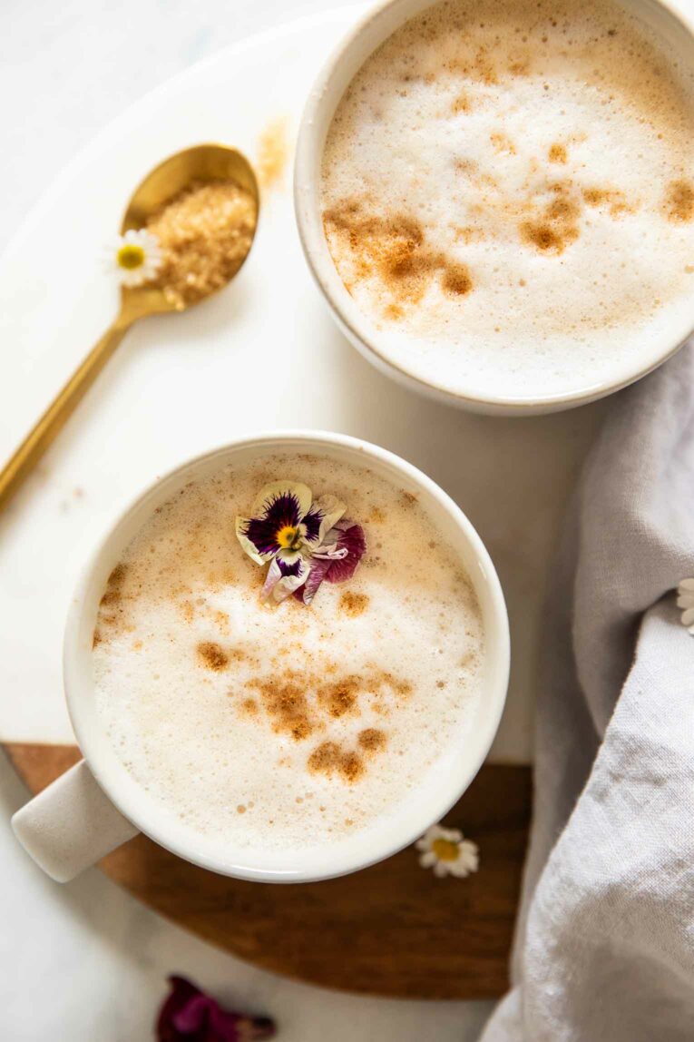 Two mugs of collagen coffee with cinnamon and sugar.