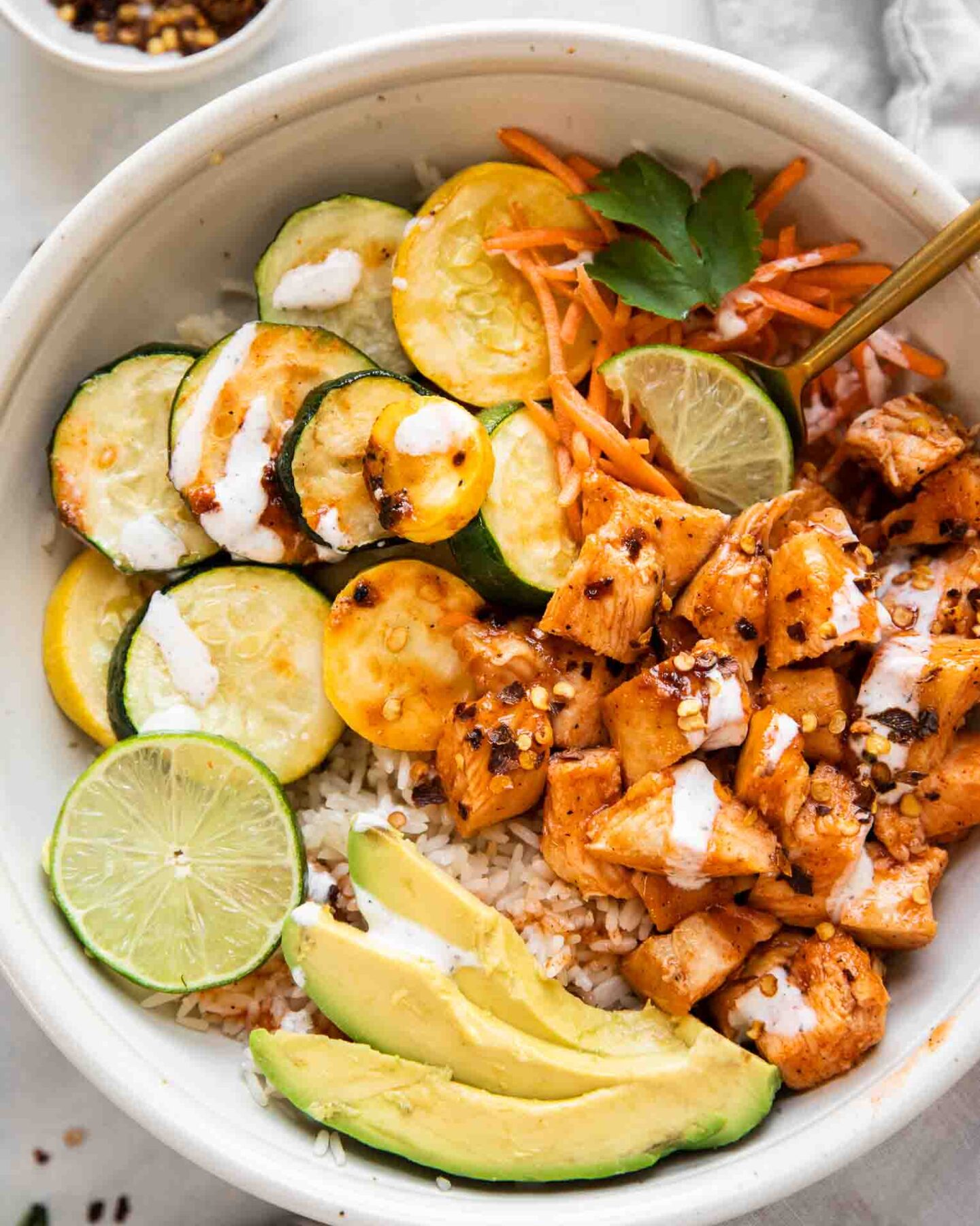 Top shot of hot honey chicken bowls.