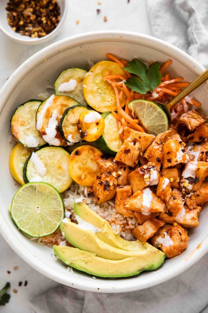 Top shot of hot honey chicken bowls.