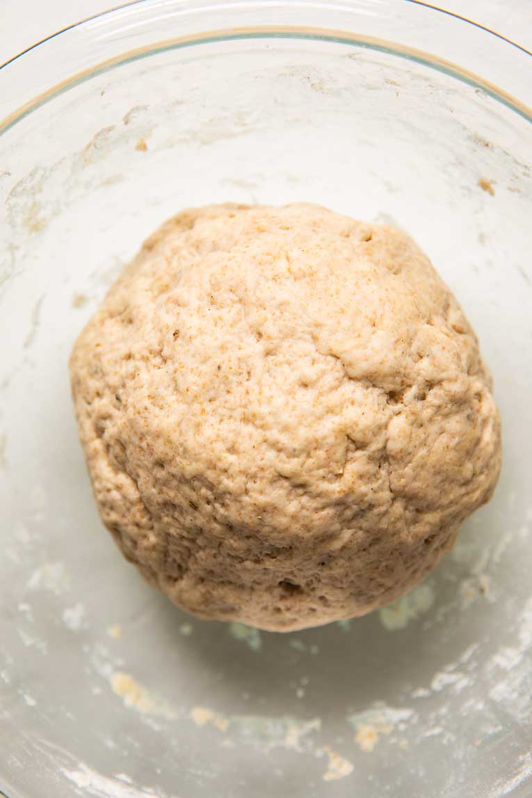Vegan Pizza Dough being mixed in a bowl.