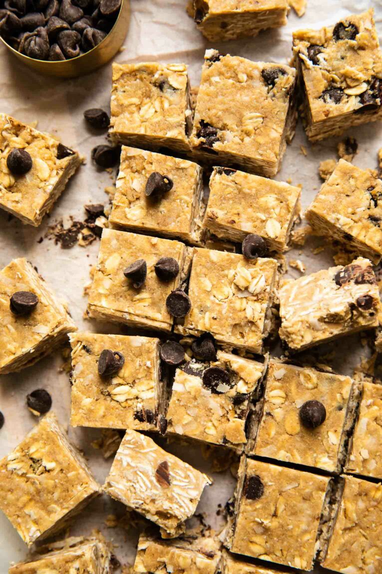 Close up of homemade heavenly hunks on parchment paper with chocolate chips.