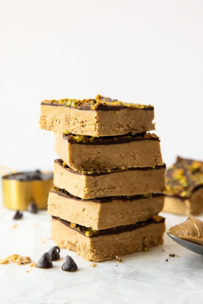 Homemade Protein Bars with peanut butter stacked on top of each other.