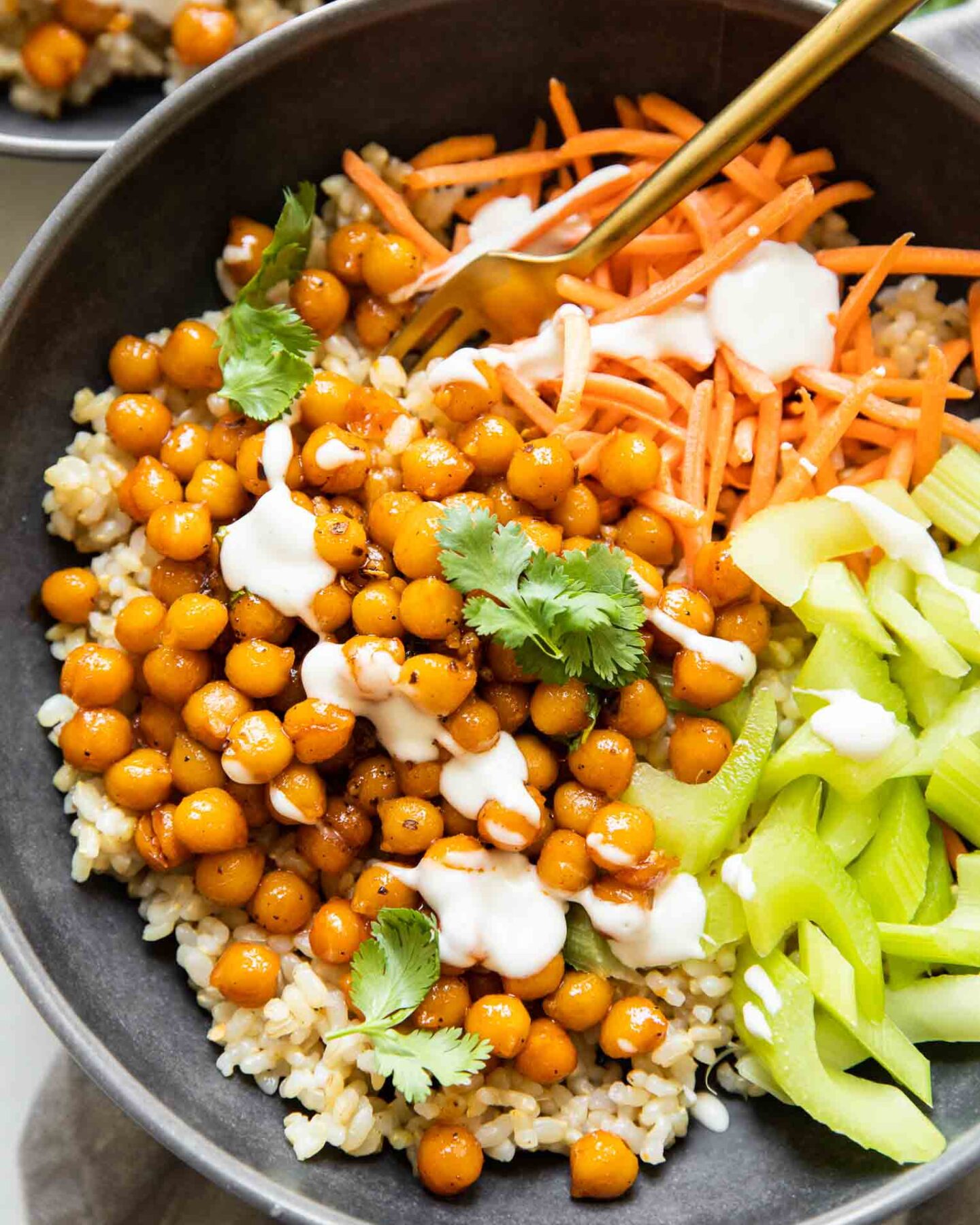 Top shot of Hot Honey Chickpeas in a bowl with celery and carrots.