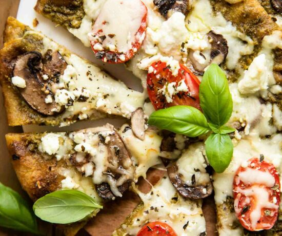 Top shot of Spinach Pesto Goat Cheese Individual Pizza.