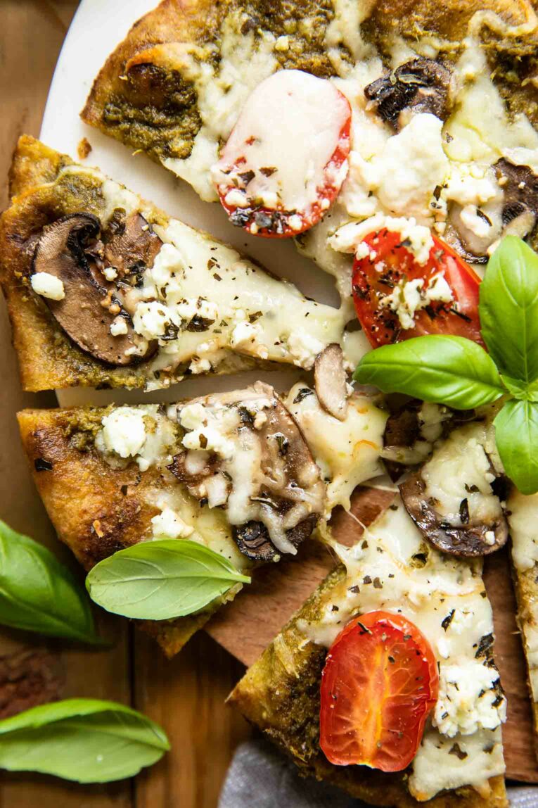Close up of spinach pesto goat cheese pizza.