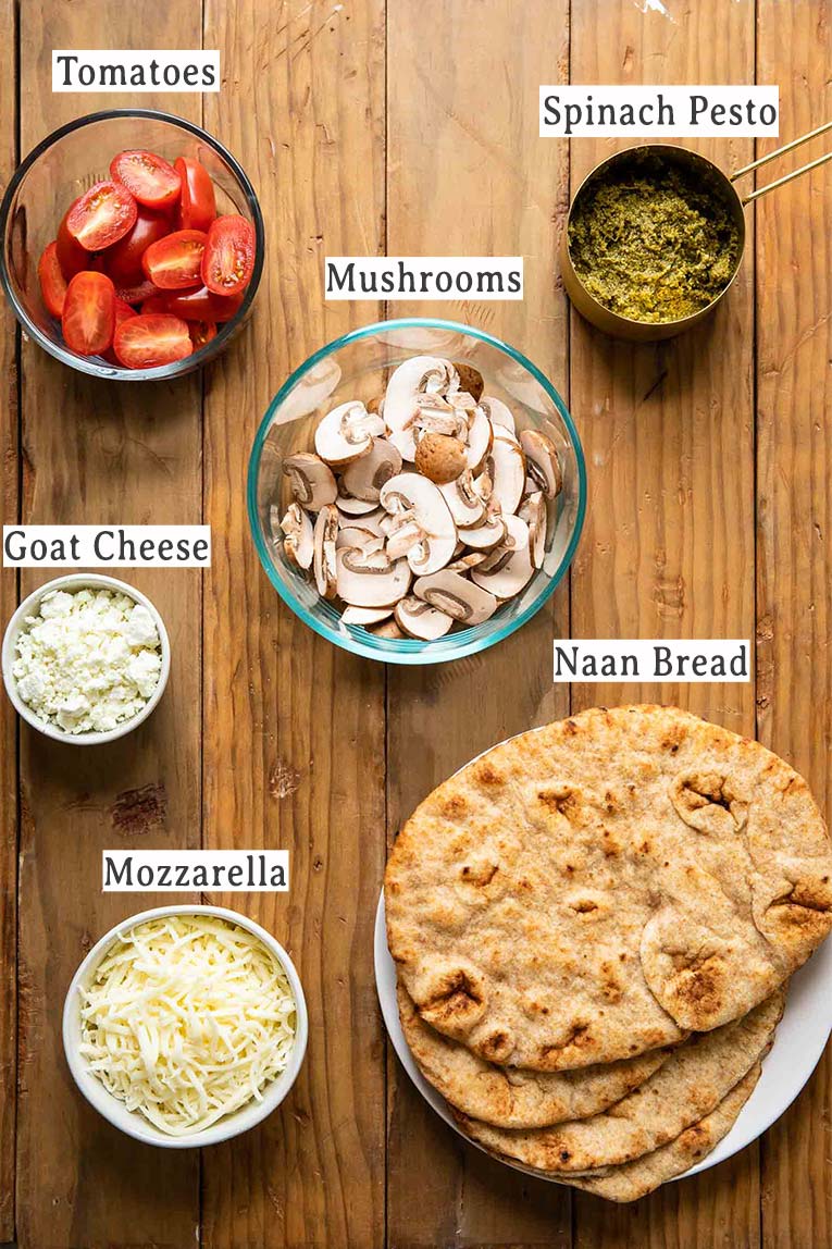 Ingredients for spinach pesto goat cheese individual pizzas.