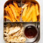 Shredded chicken with barbecue sauce, sweet potato fries, and peaches.