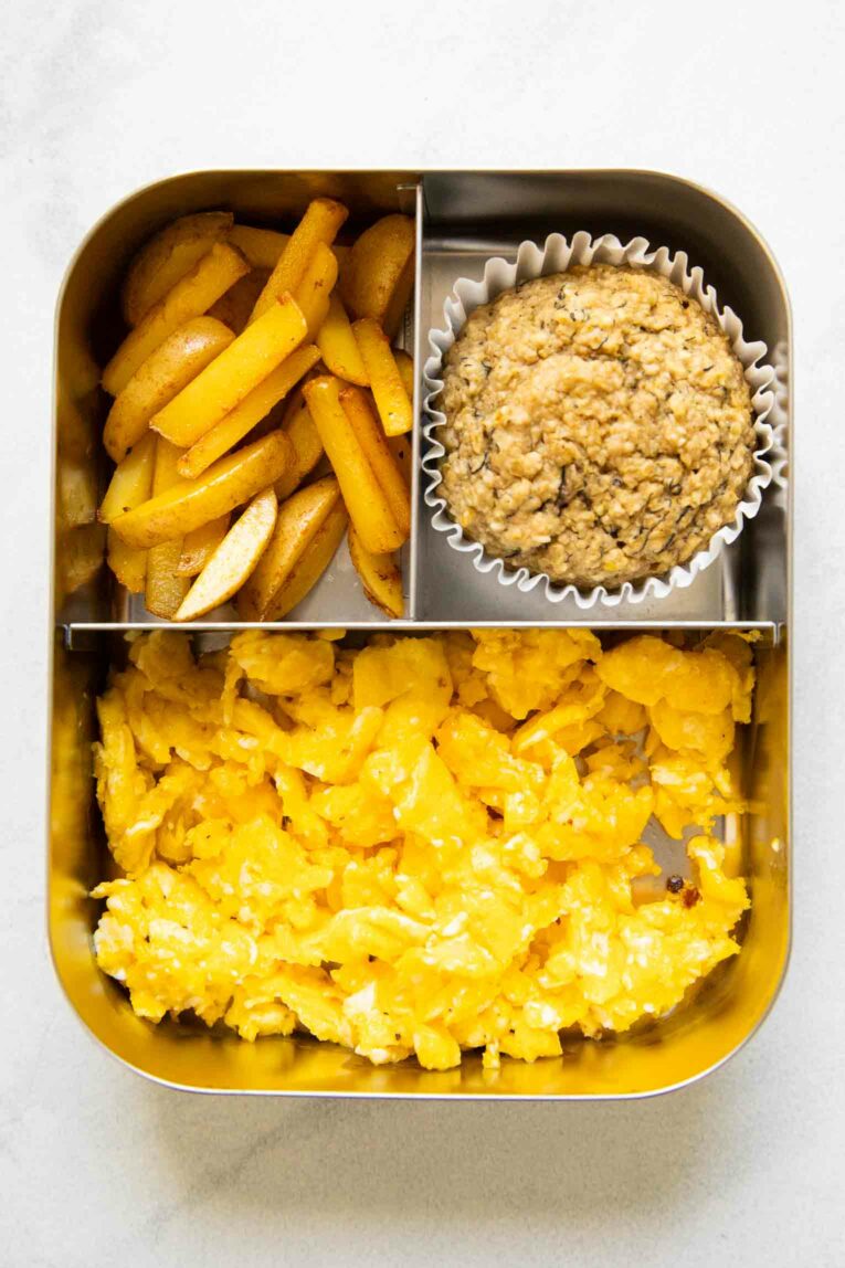 Scrambled eggs, potatoes, and a toddler muffin for a lunch idea.
