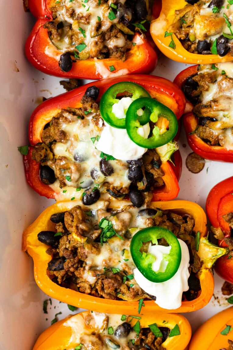 Taco stuffed bell peppers on a white background.