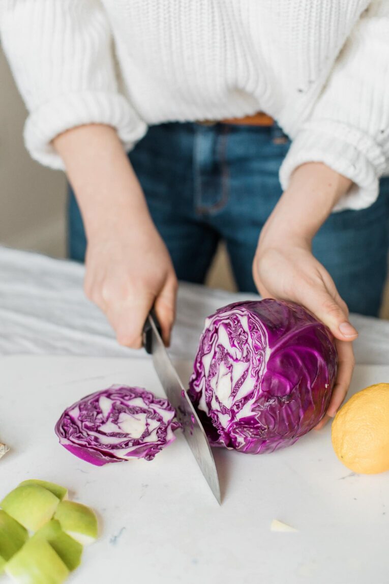 Batch cooking and cutting red cabbage.