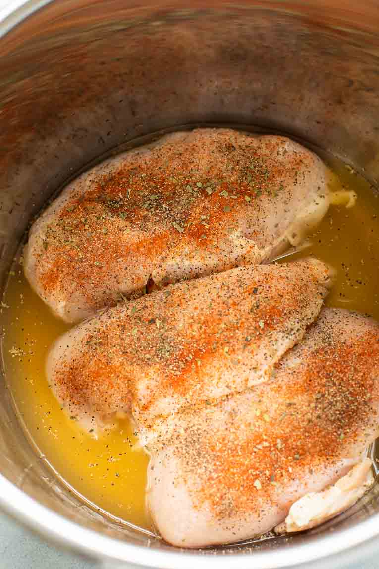 Rotisserie chicken seasoning over chicken in Instant Pot.