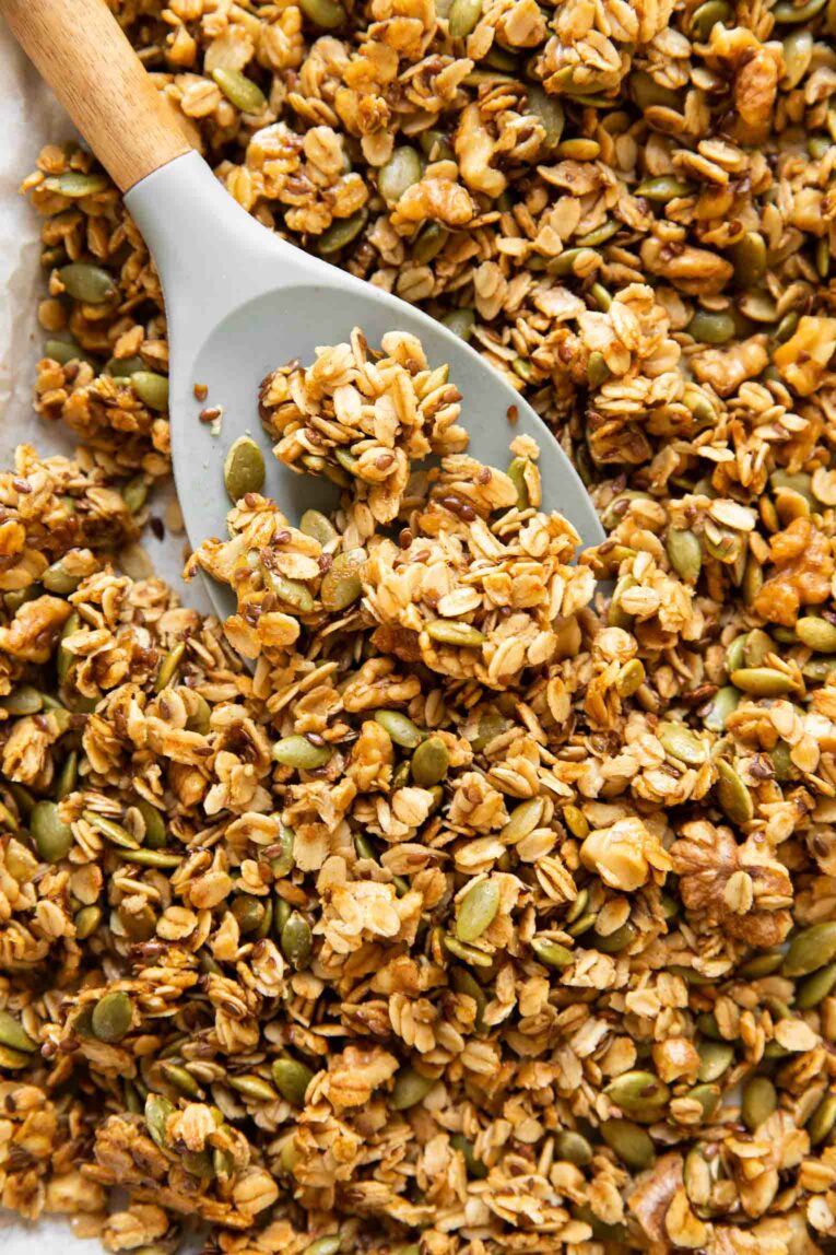 Close up of Pumpkin Flax Granola recipe with a spoon.