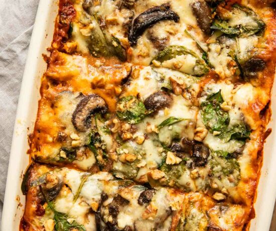 Top shot of vegetarian lasagna with spinach and mushrooms.