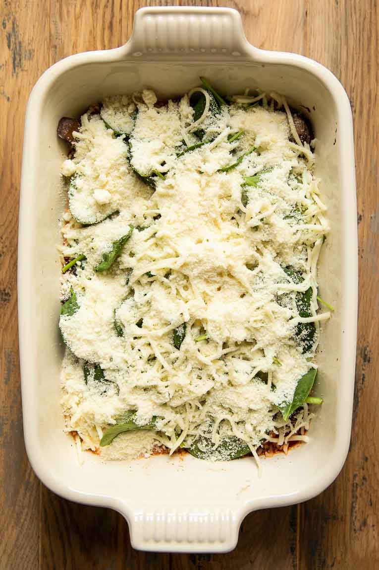 Parmesan and mozzarella in a layer of lasagna.