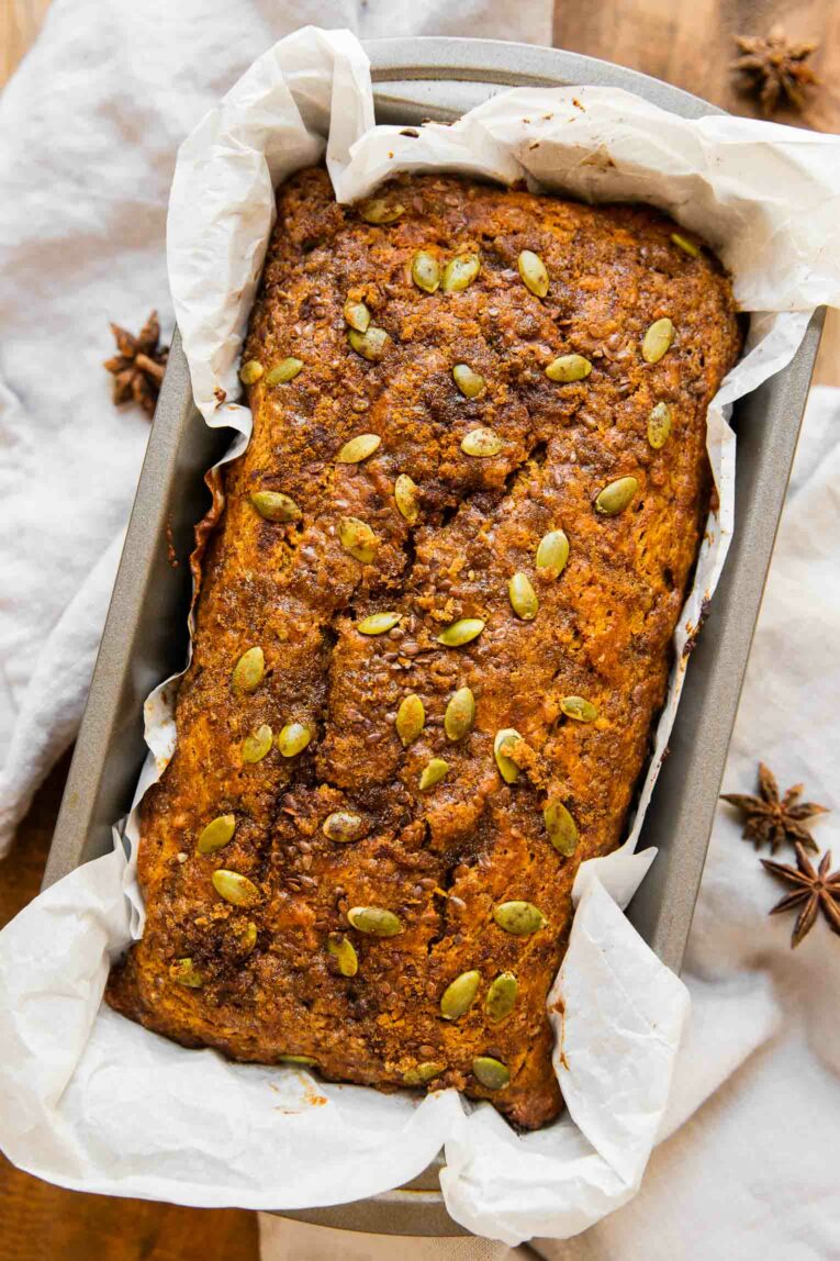 Freshly baked healthy pumpkin bread in a loaf pan.