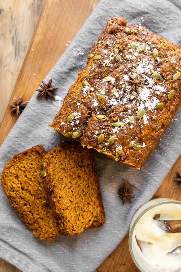 Top shot of pumpkin bread with butter and sugar.