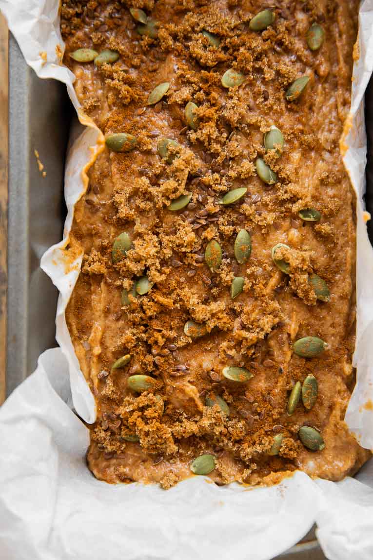 Pumpkin bread batter poured into a loaf pan.