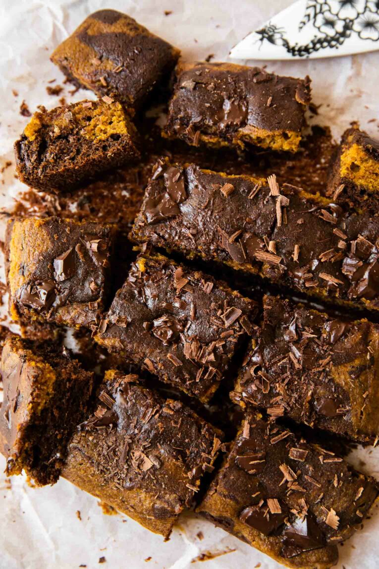 Top shot of pumpkin brownies with chocolate chunks.