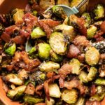 Air fryer brussels sprouts and bacon with parmesan in a bowl.