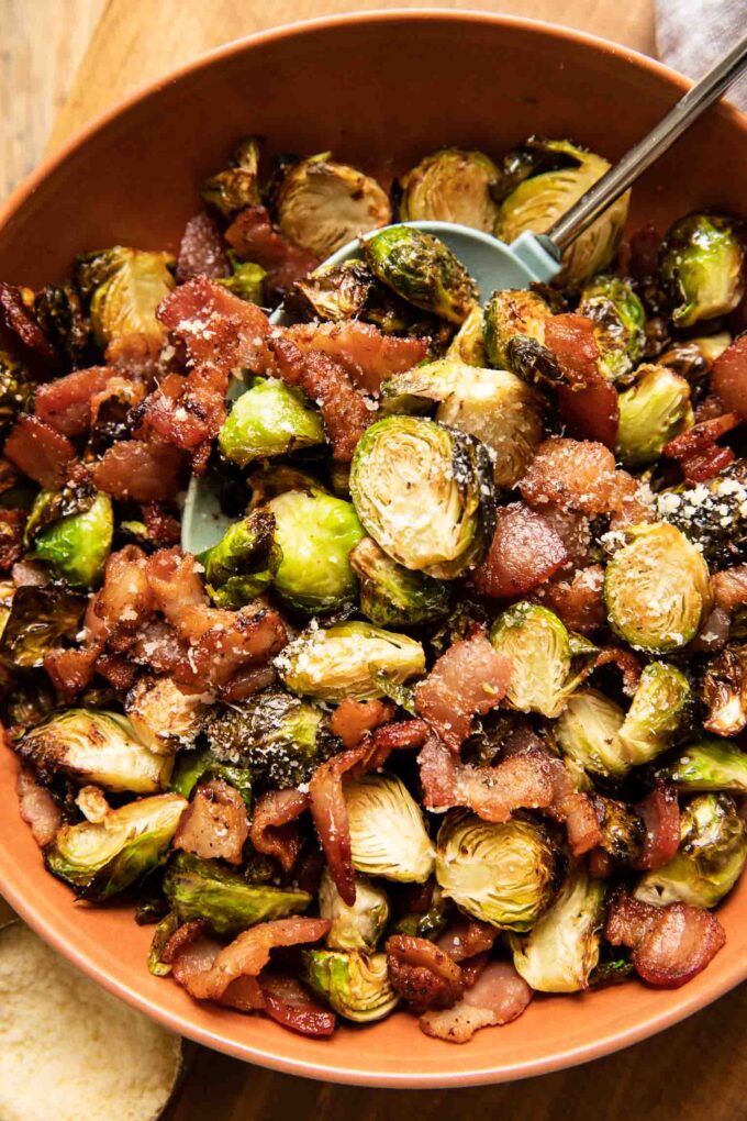 Air fryer brussels sprouts and bacon with parmesan in a bowl.