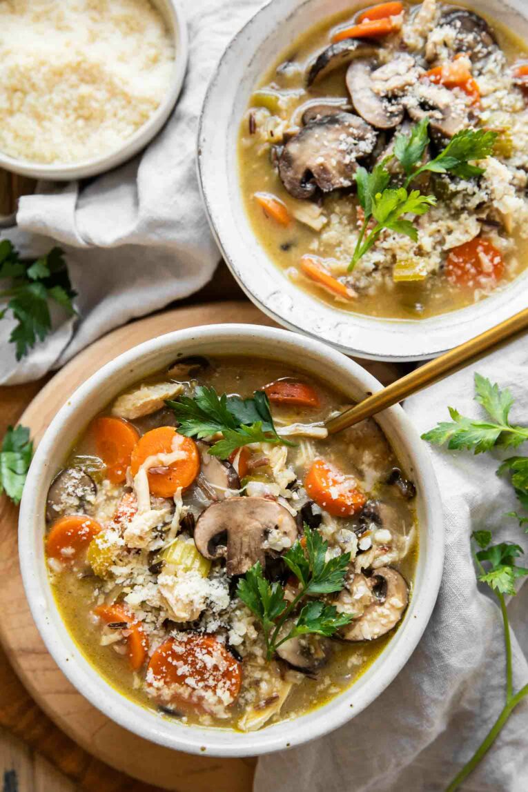 Two bowls of creamy turkey wild rice soup.
