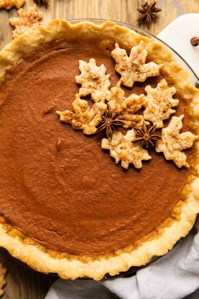 Close up of dairy-free pumpkin pie with cookies on top.