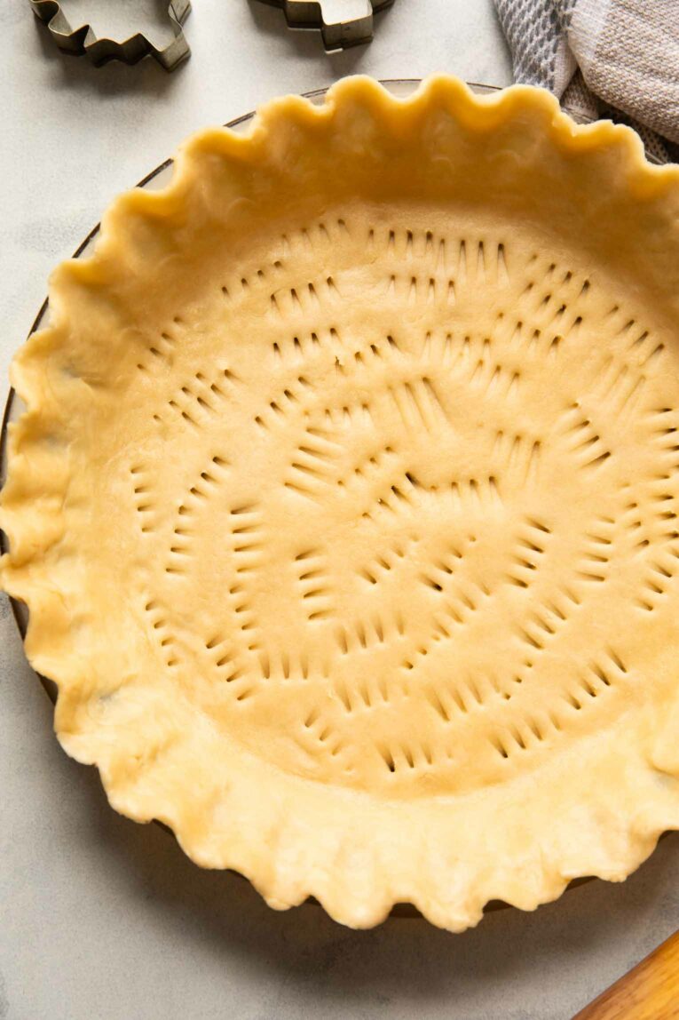 Close up image of vegan pie crust in a pan.