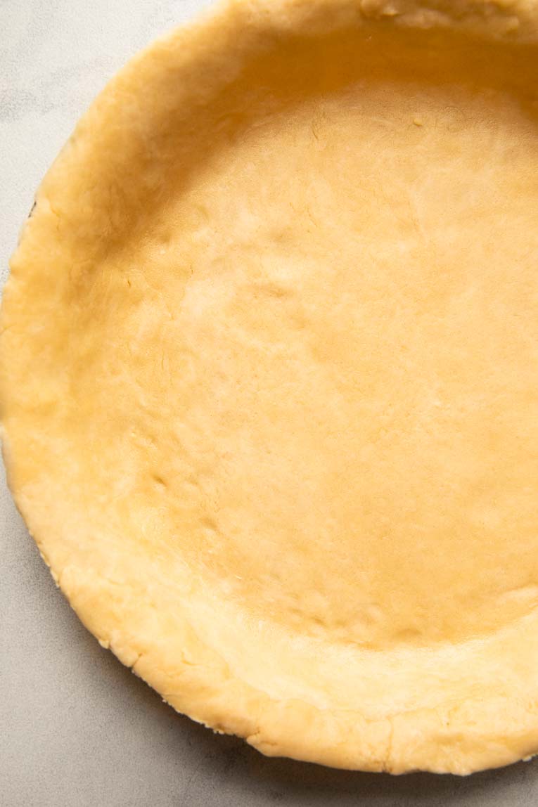 Pie crust pressed into a pie pan.