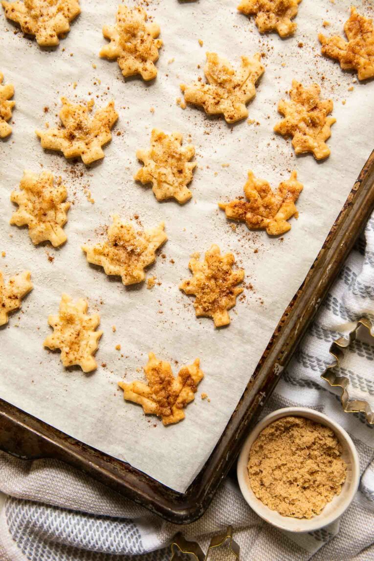 Top shot of pie crust cookies on parchment paper.