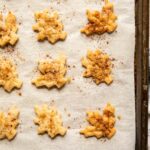 Close up of pie crust cookies on a baking sheet.