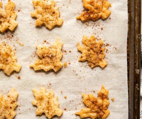 Close up of pie crust cookies on a baking sheet.