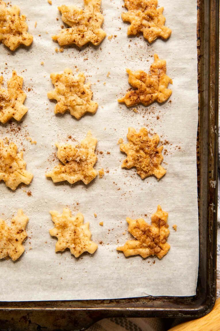 Close up of pie crust cookies on a baking sheet.