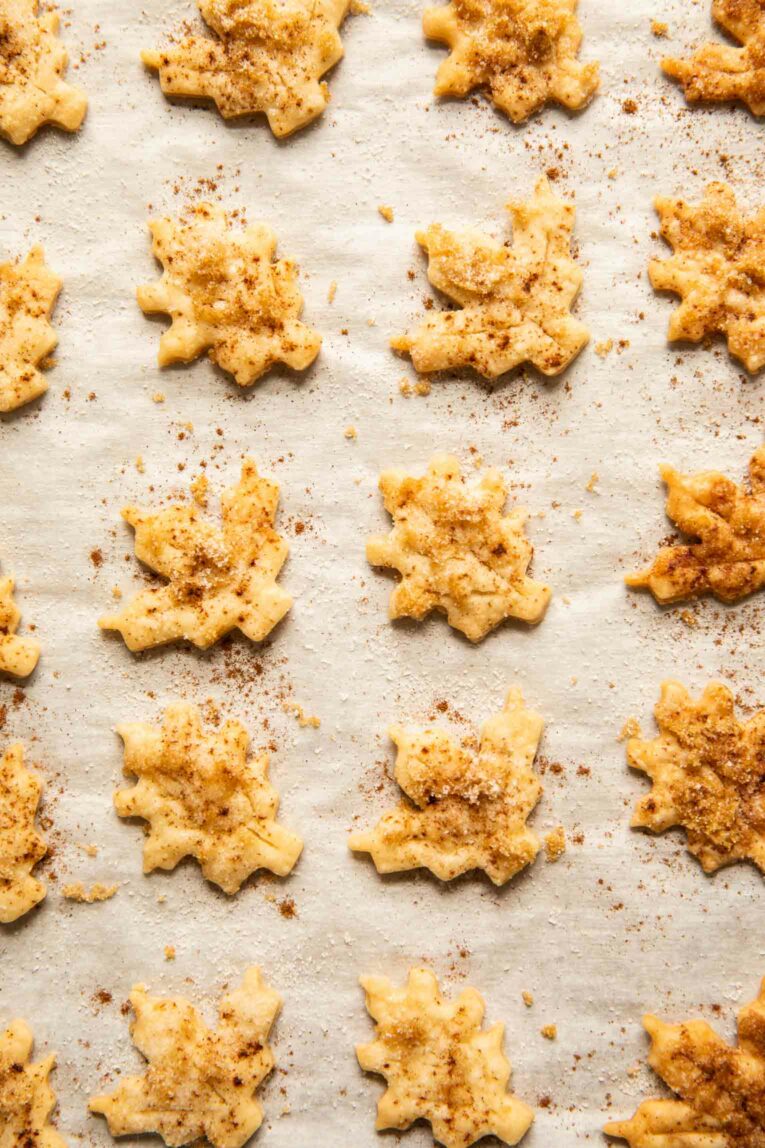 Top shot of pie dough cookies on parchment paper.