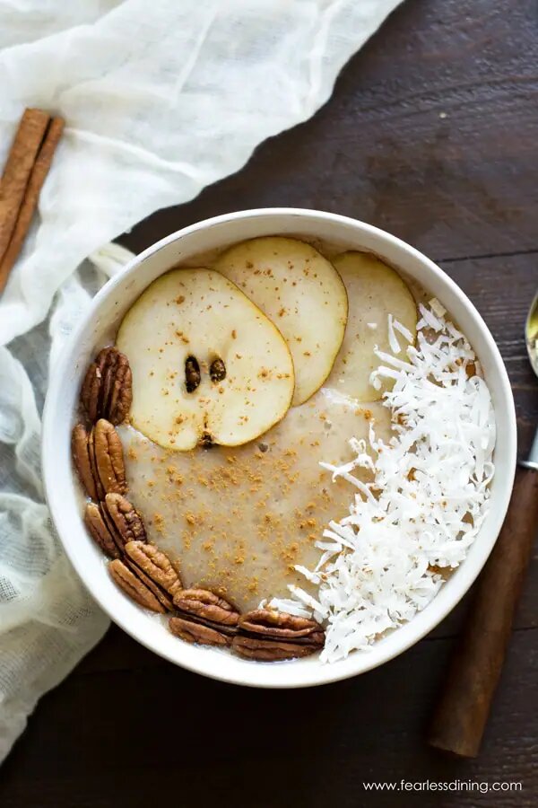 Pear Smoothie Bowl Recipe with fresh toppings in a bowl.