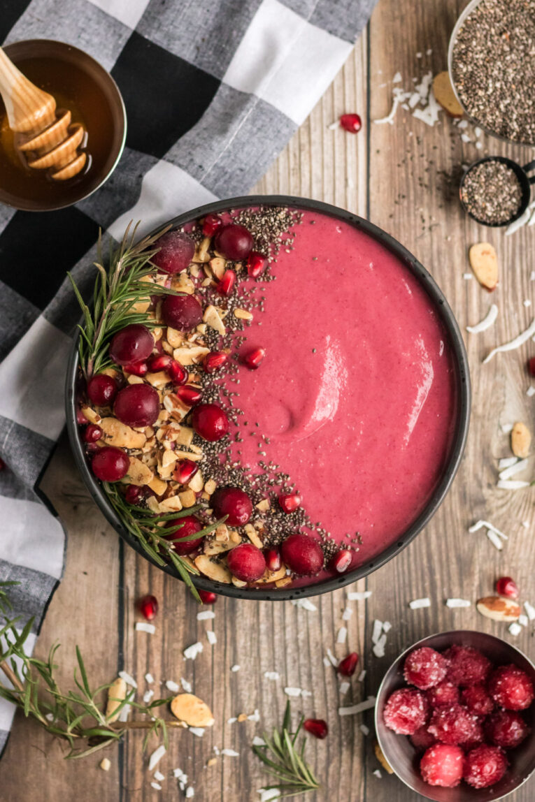 Cranberry Smoothie Bowl on a wood table.