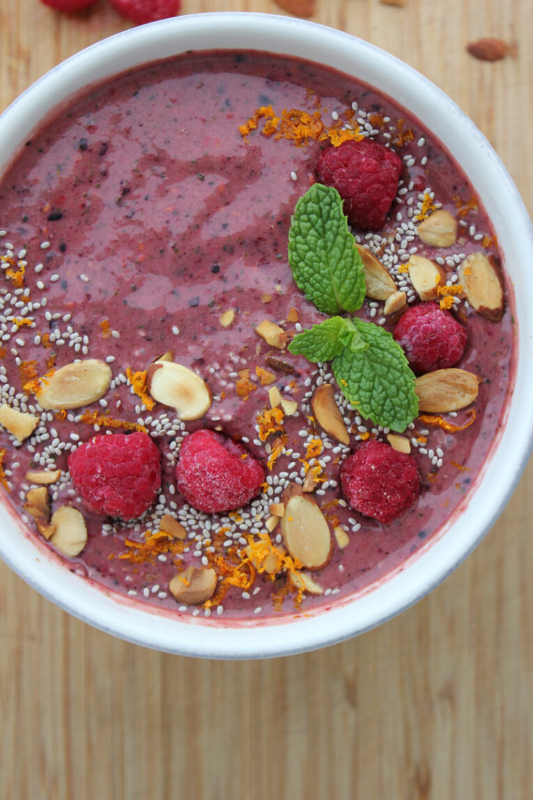 Top photo of Berry Orange Smoothie Bowl on a countertop.
