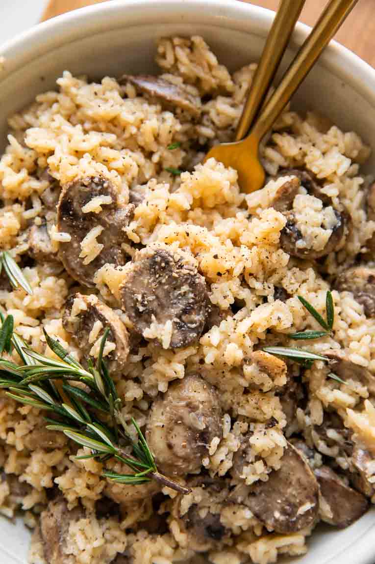 Close up of mushroom rice pilaf with rosemary.