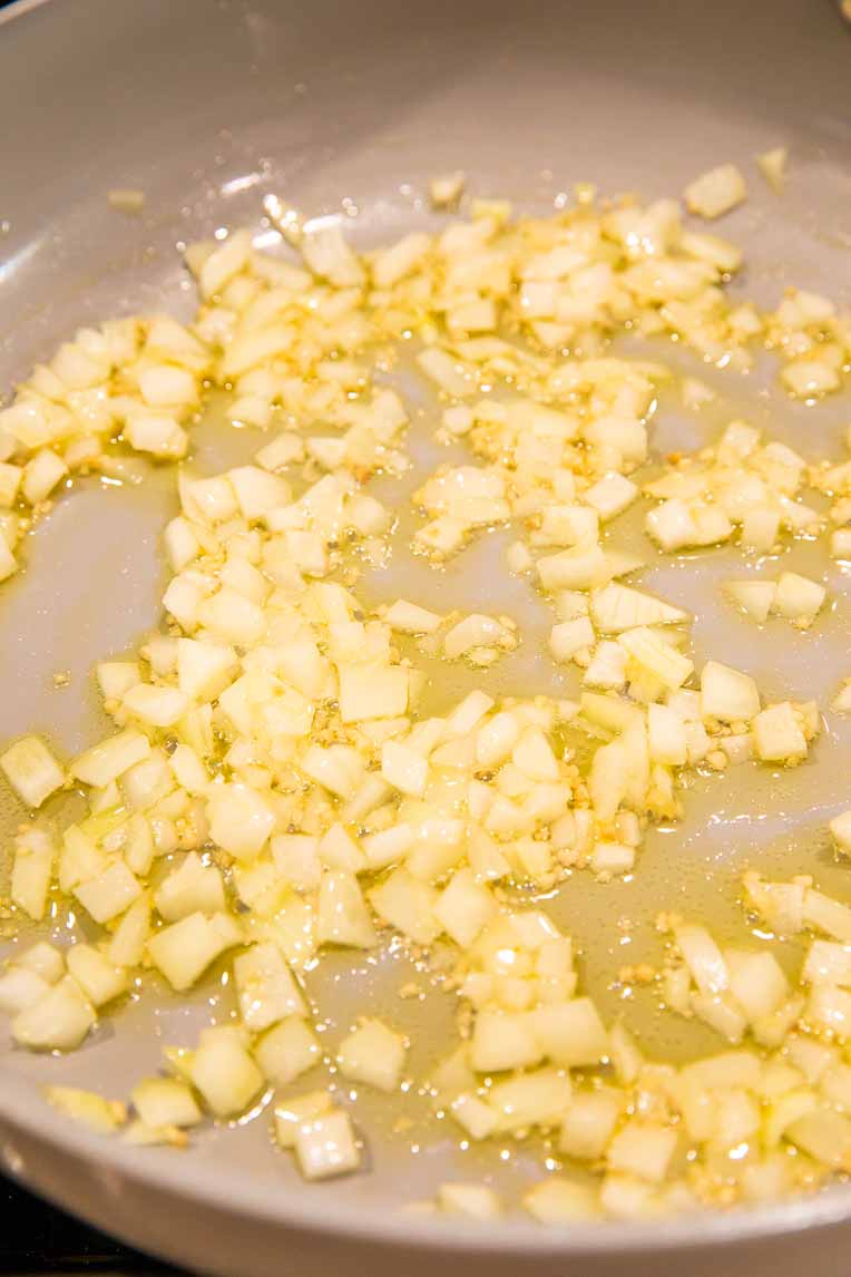Onions and garlic cooking in oil.