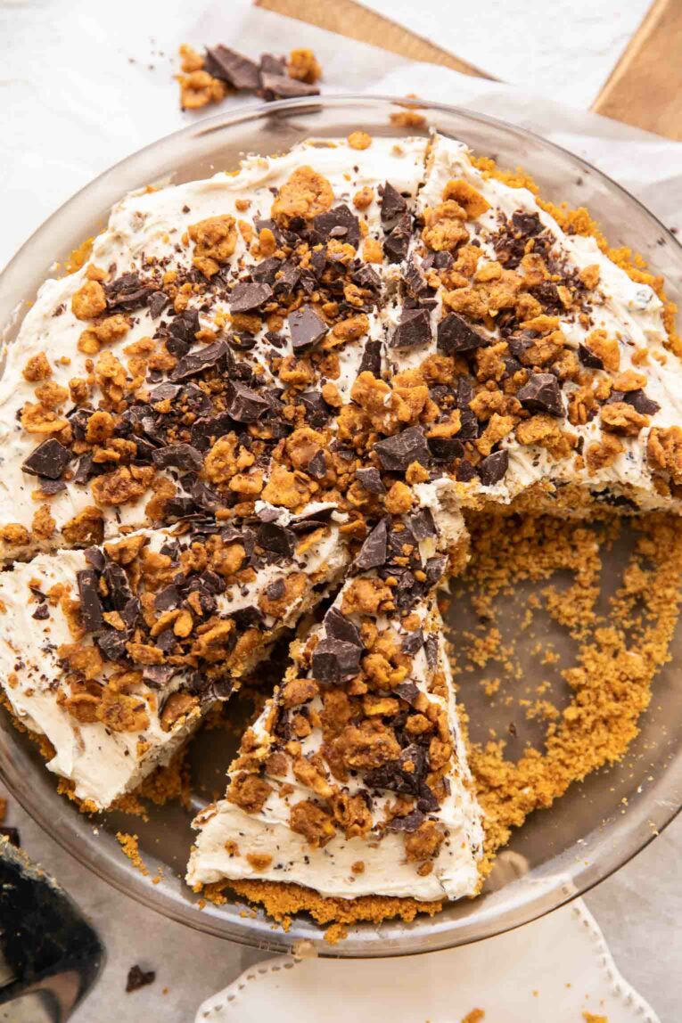 Top angle of vegan cheesecake with butterfinger and graham cracker crust.