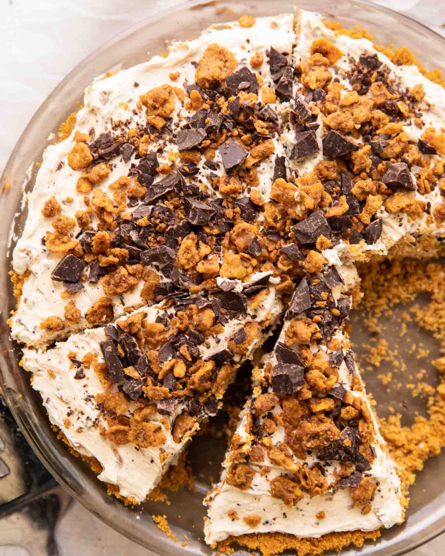 Vegan Butterfinger Cheesecake with slices taken out.