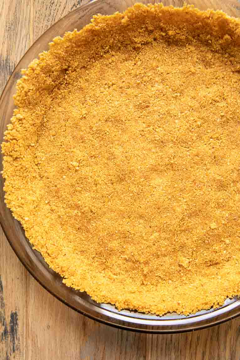 Gluten-free graham cracker pie crust in a pie pan.