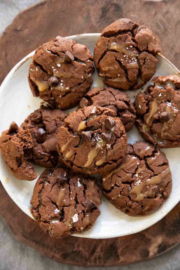Top photo of Vegan Salted Caramel Chocolate Cookies on a white plate.