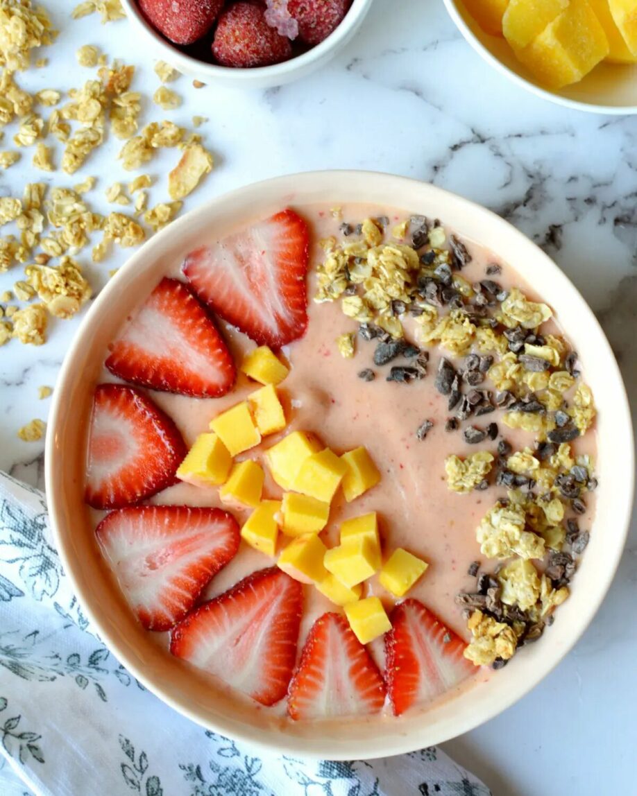 Strawberry Mango Smoothie bowl on a countertop.