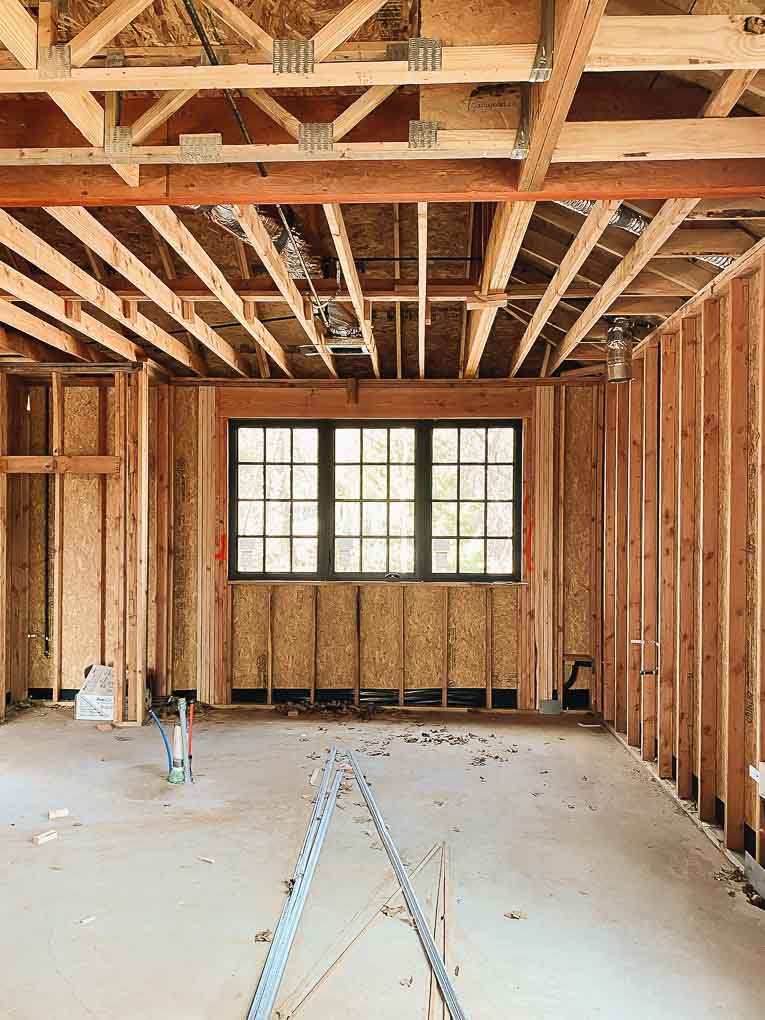 Black grid windows in framed kitchen.