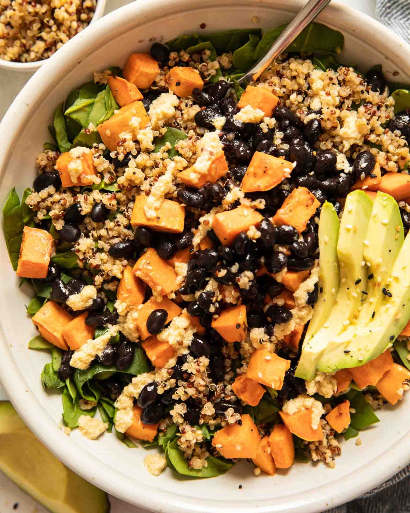 Top shot of sweet potato black bean quinoa salad with avocado.