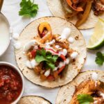 The BEST Chicken Fajita Tacos with a cream sauce and cilantro.