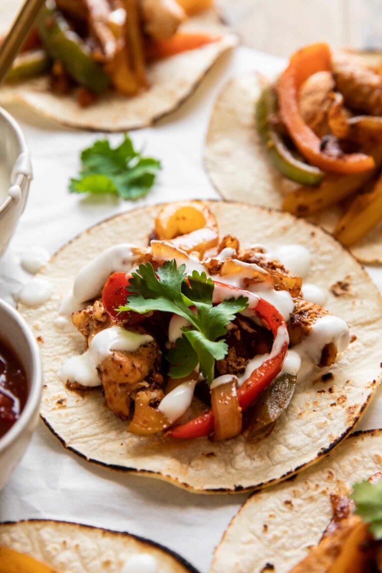 Angled photo of chicken fajita tacos.