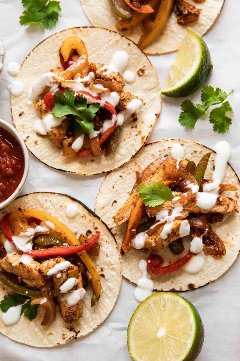 Chicken fajitas on corn tortillas for tacos.