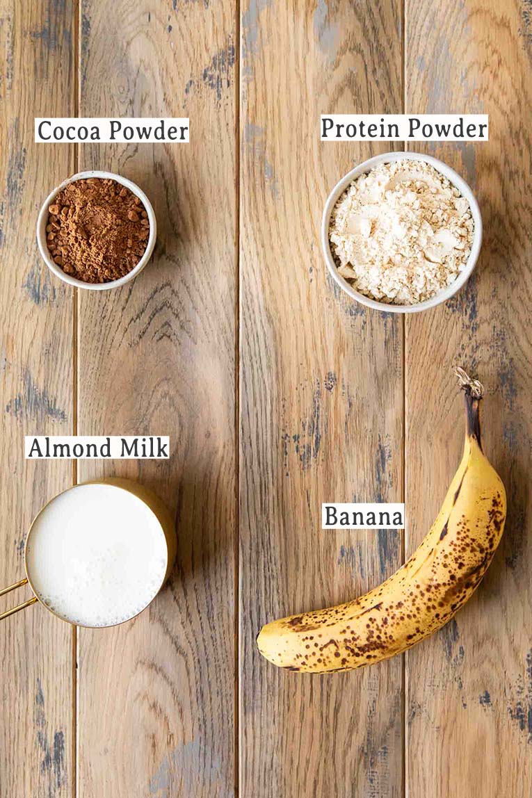 Ingredients for how to make a chocolate banana smoothie with protein.