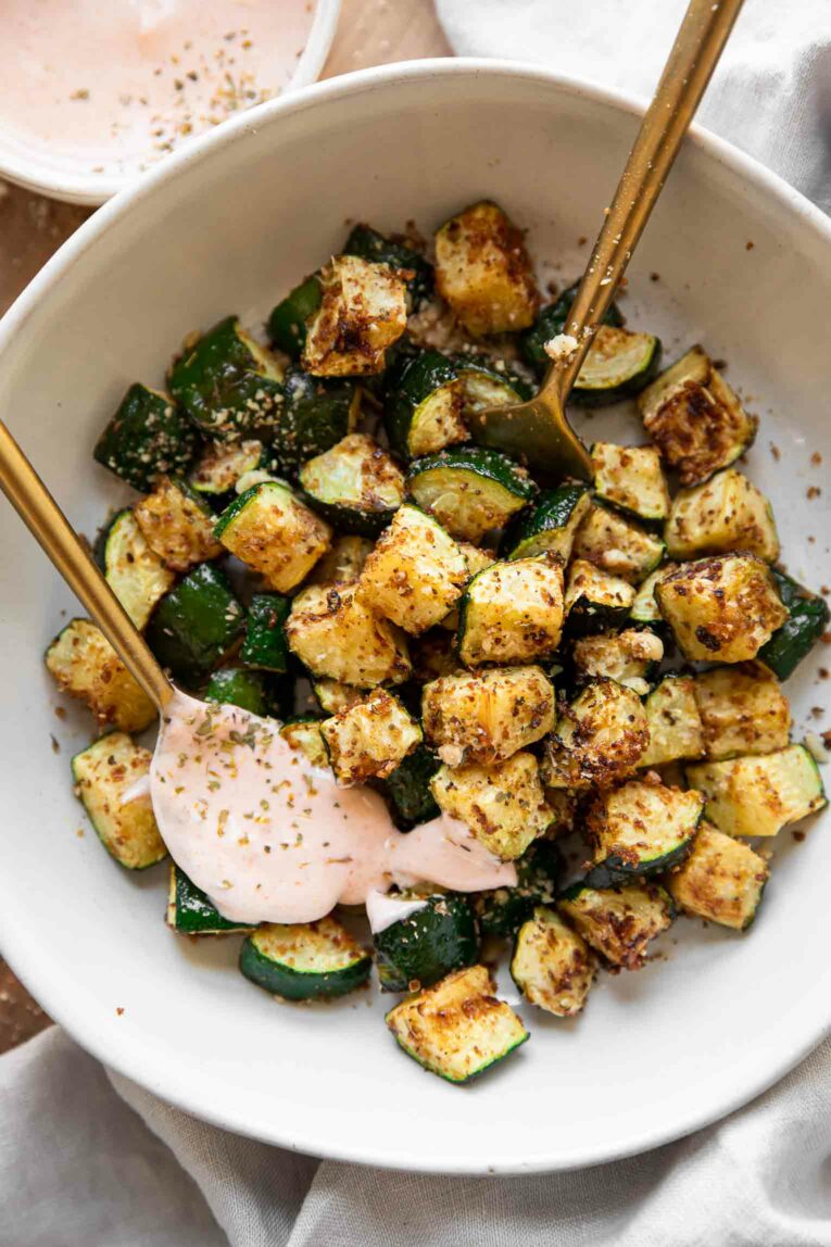 Air fryer zucchini with a spicy cream sauce.